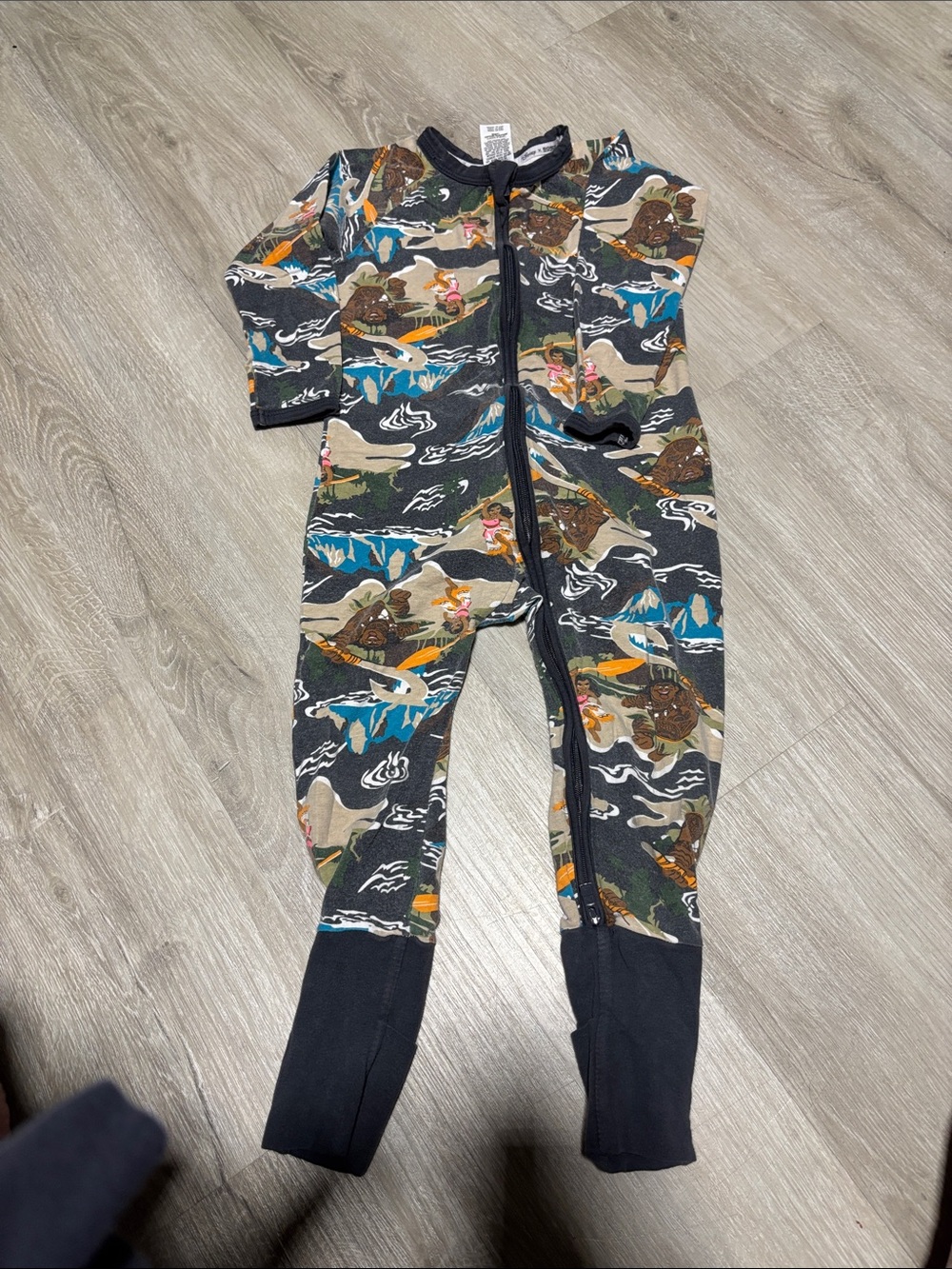 Bonds Disney Footed Zip One-Piece in Black with Multicolor Adventure Print